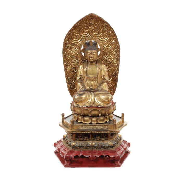 A Taishō period gilt and lacquer seated carved figure of Nyoirin Kannon. Sold for £9,375