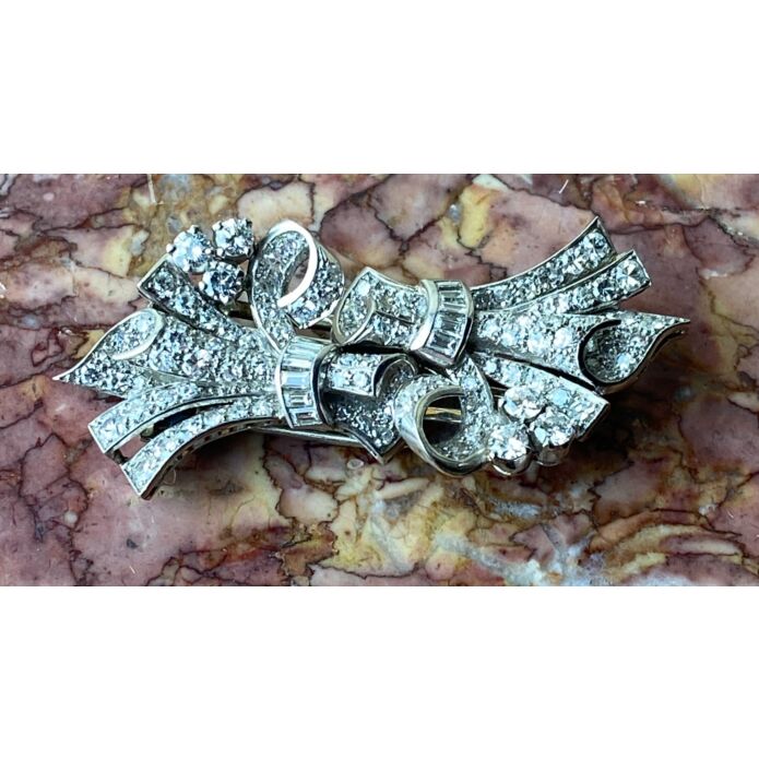 A late Art Deco diamond double clip brooch, English c. 1942. Sold for £3,125