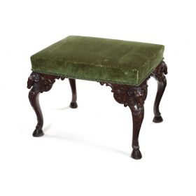 A late 19th century carved mahogany stool in the Adam style