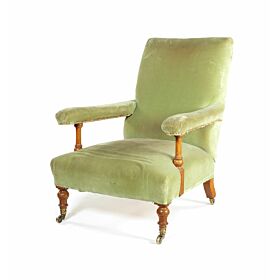 A Victorian walnut easy open armchair by Howard & Sons Ltd