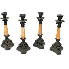 A set of four French mid-19th century patinated bronze and yellow sienna marble candlesticks by Denière, Paris