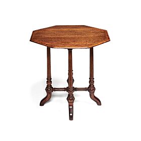 A Victorian oak occasional table in the manner of Gillows