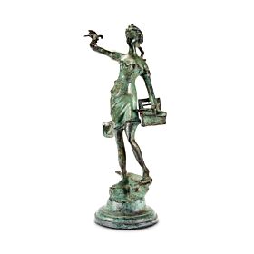 Mid-Century verdigris bronze figure of a girl releasing doves