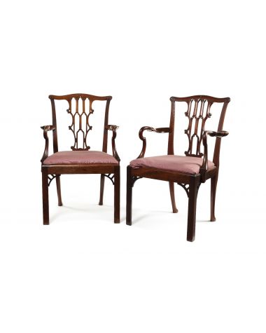A pair of late 19th century Chippendale Gothick style mahogany open armchairs