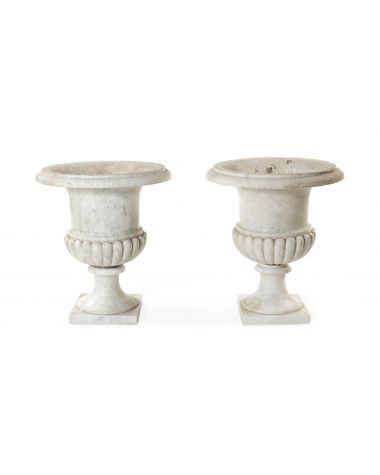 A pair of 19th century carved white veined marble Campana urns