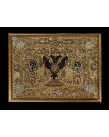 A late 17th century European raised work and metallic thread heraldic embroidery