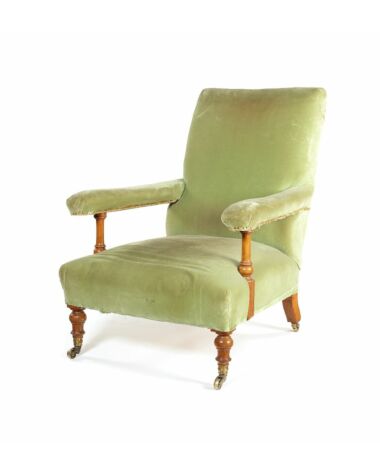 A Victorian walnut easy open armchair by Howard & Sons Ltd