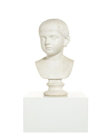 A late 18th/early 19th century white marble bust of a young boy