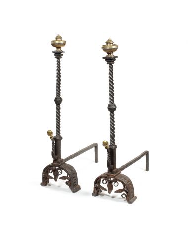 A pair of late 17th century Italian wrought iron and gilt brass fire dogs