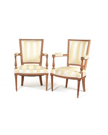A pair of Louis XVI beechwood carved fauteuils