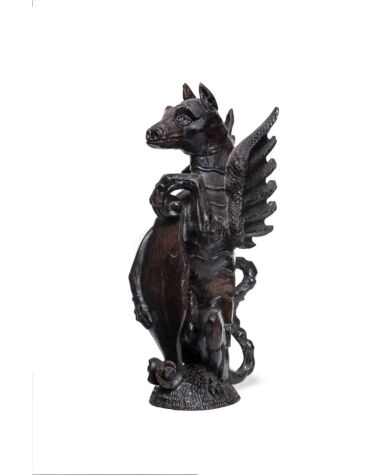 A carved oak heraldic dragon newel post finial, English, circa 1550. Sold for £9750