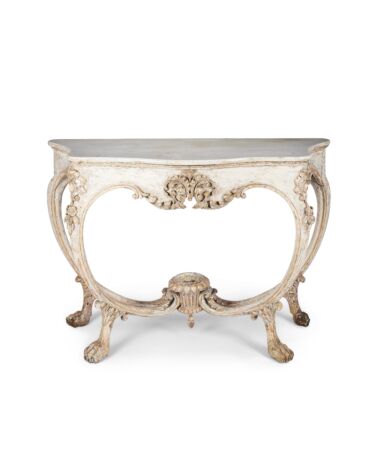 A 19th century Italian white painted and silvered serpentine console table