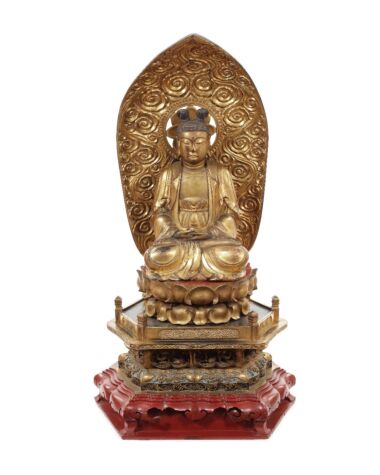 A Taishō period gilt and lacquer seated carved figure of Nyoirin Kannon. Sold for £9,375