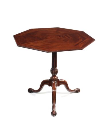 A George III carved mahogany octagonal tripod table attributed to Thomas Chippendale. Sold for £31,200