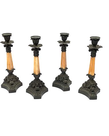 A set of four French mid-19th century patinated bronze and yellow sienna marble candlesticks by Denière, Paris