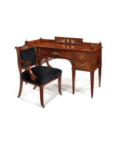A 19th century mahogany, gilt bronze mounted Empire style desk and chair