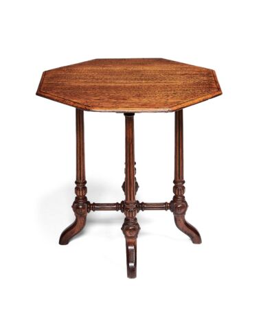 A Victorian oak occasional table in the manner of Gillows