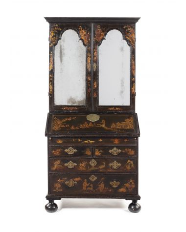 An early 18th century Queen Anne black japanned bureau cabinet 