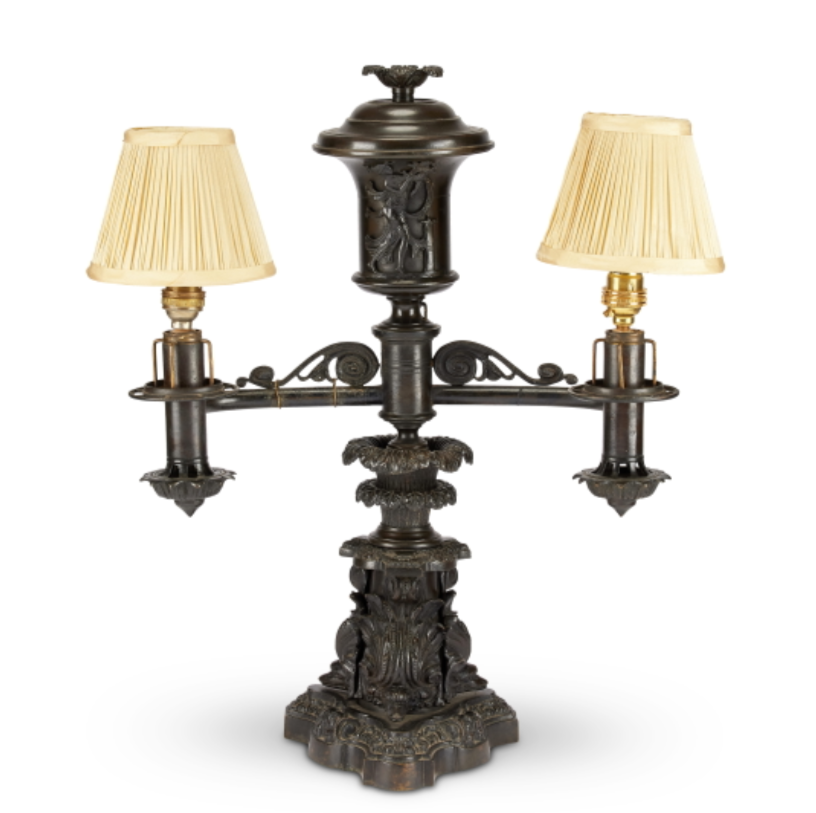 A Regency patinated bronze twin branch gravity fed oil lamp