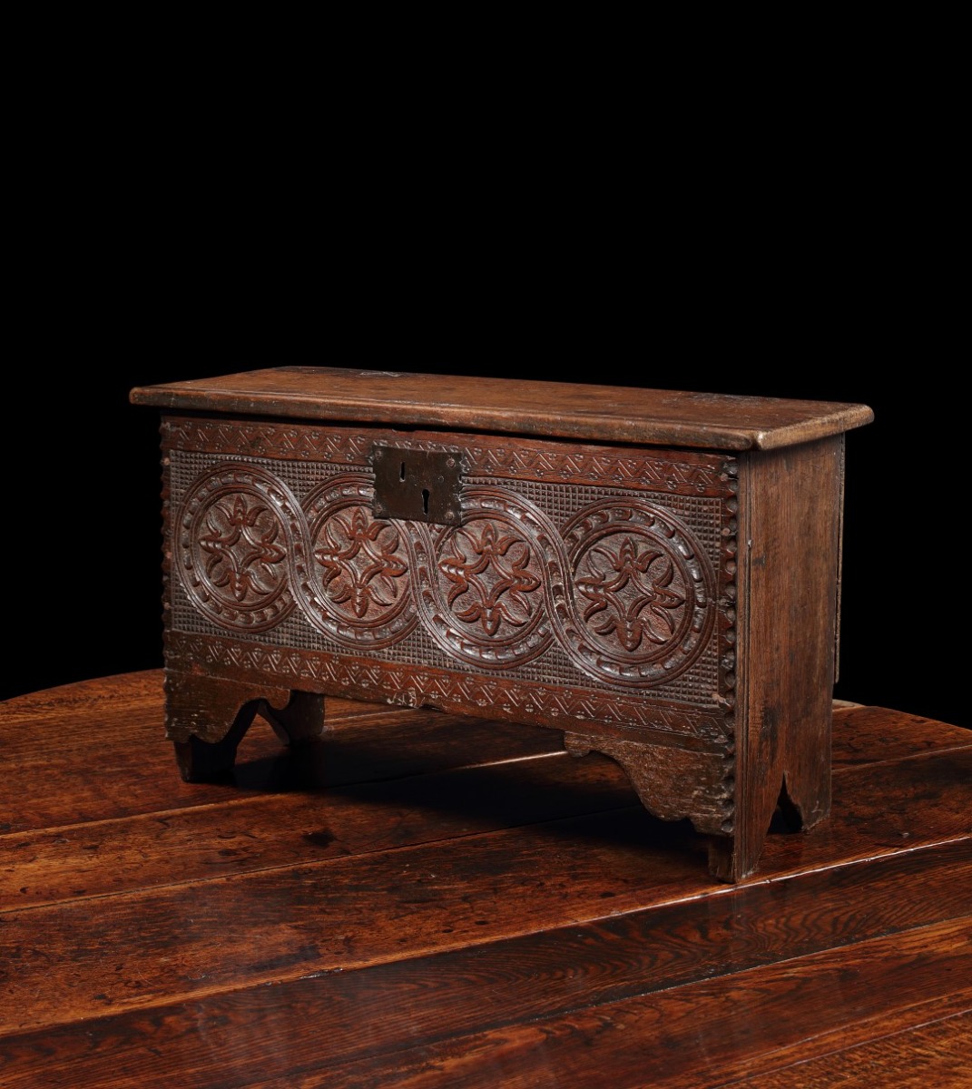 A Charles I carved oak boarded child's plank chest