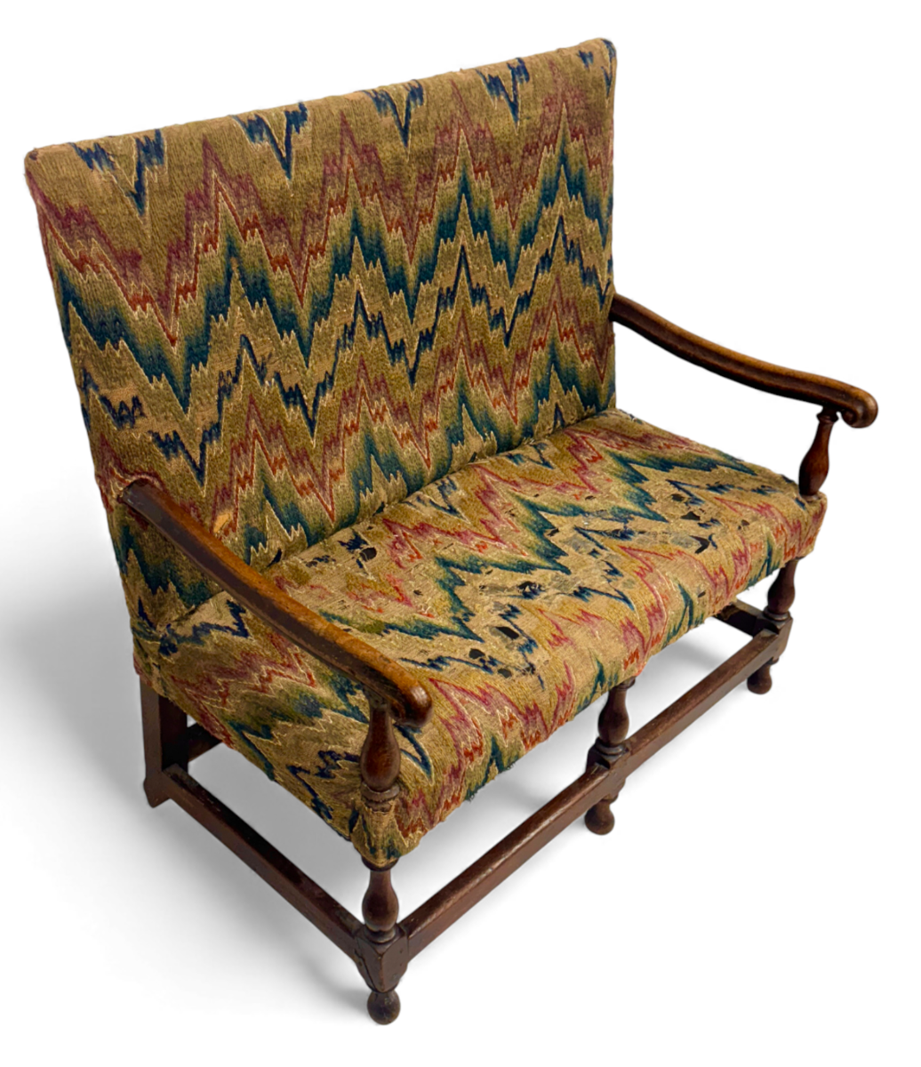 A rare William & Mary oak-framed and upholstered two seater sofa